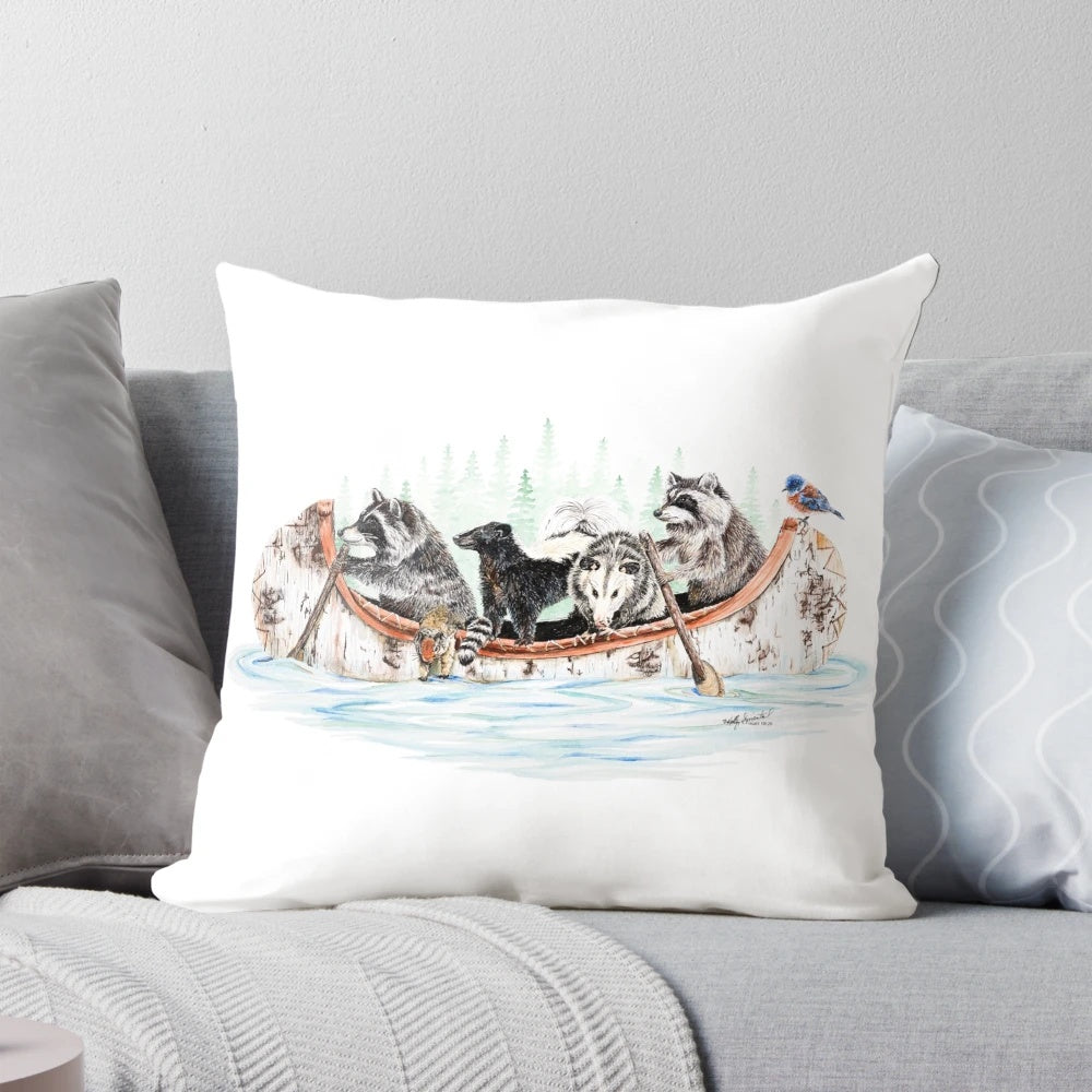 A colorful and whimsical pillow featuring a group of forest animals in a canoe, perfect for nature and wildlife enthusiasts.