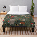 Soft and warm plush blanket featuring adorable forest animals like bears and hedgehogs in an autumn woodland setting