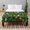 A cozy plush blanket featuring a forest scene with bigfoot, sasquatch, and other nature elements.
