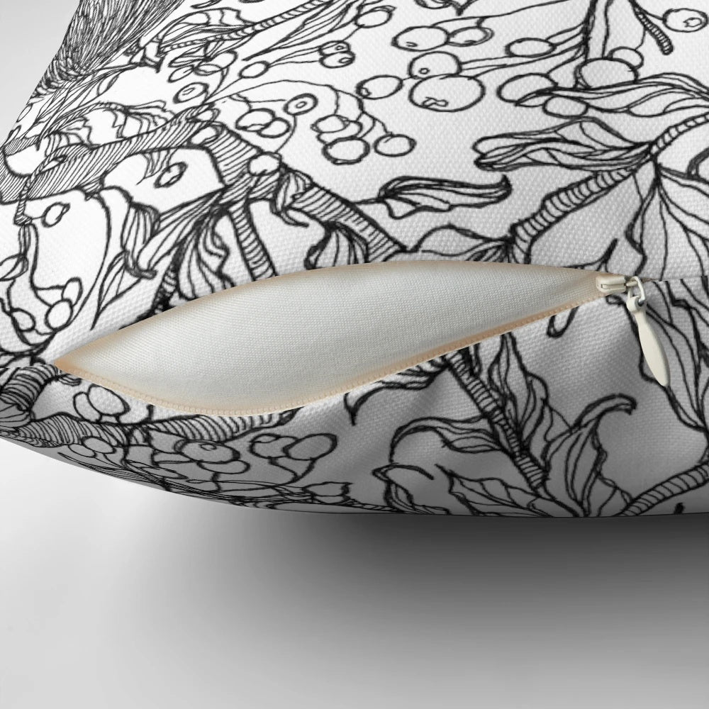 Decorative pillow featuring a squirrel and bird in a forest setting