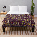 Forest-inspired plush blanket with nature-themed pattern
