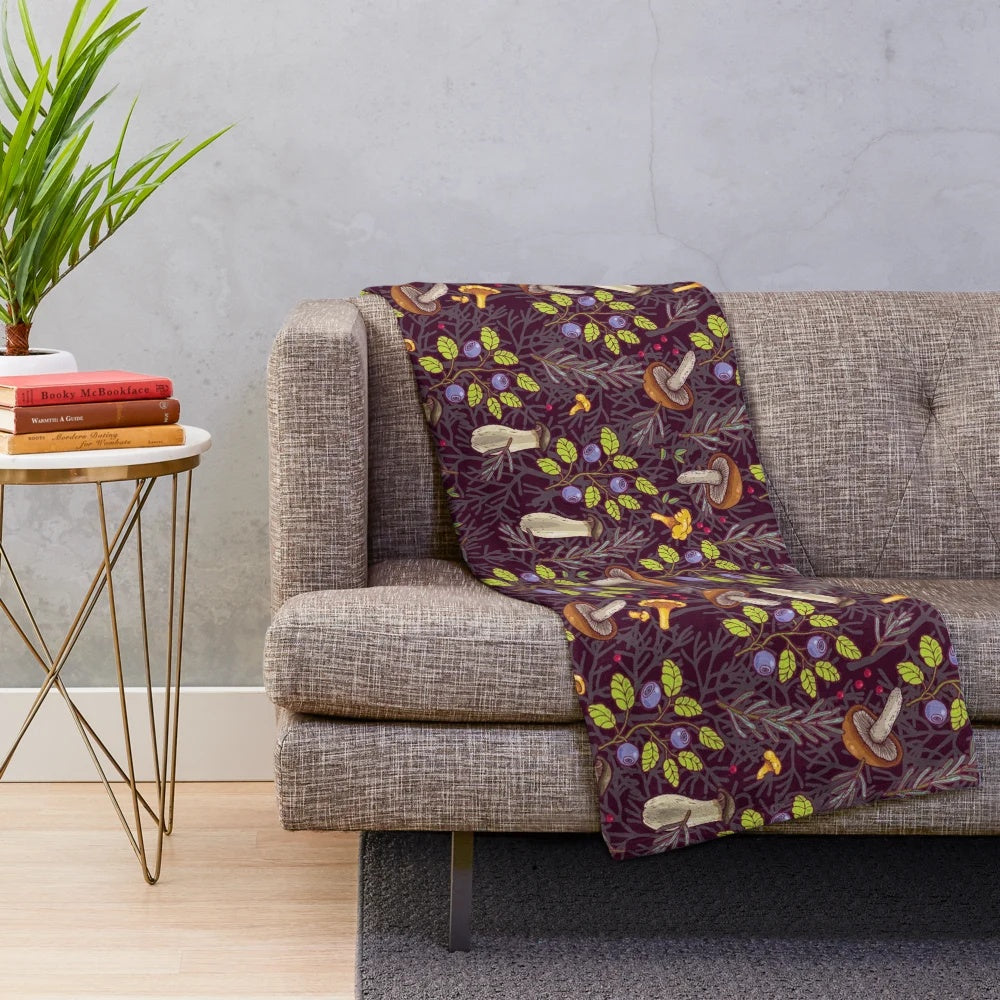 Forest-inspired plush blanket with nature-themed pattern