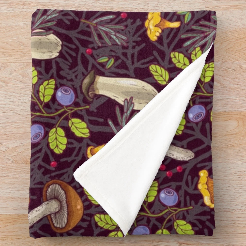 Forest-inspired plush blanket with nature-themed pattern