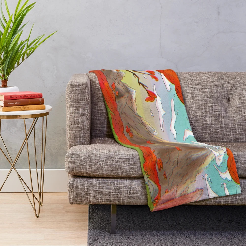 Plush blanket with a forest landscape design