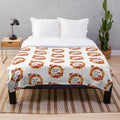 Plush blanket featuring a whimsical fox design in autumn colors