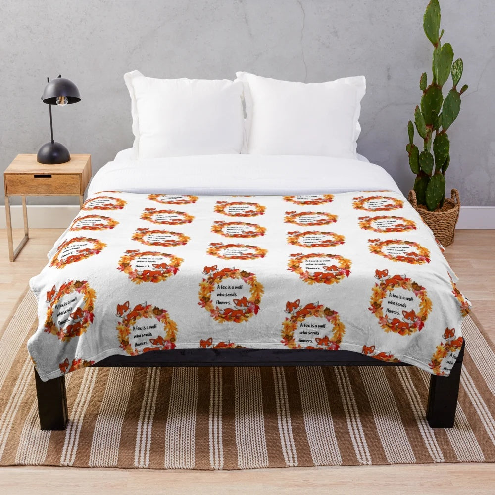 Plush blanket featuring a whimsical fox design in autumn colors