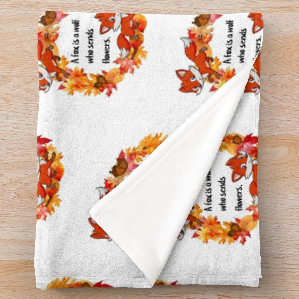 Plush blanket featuring a whimsical fox design in autumn colors