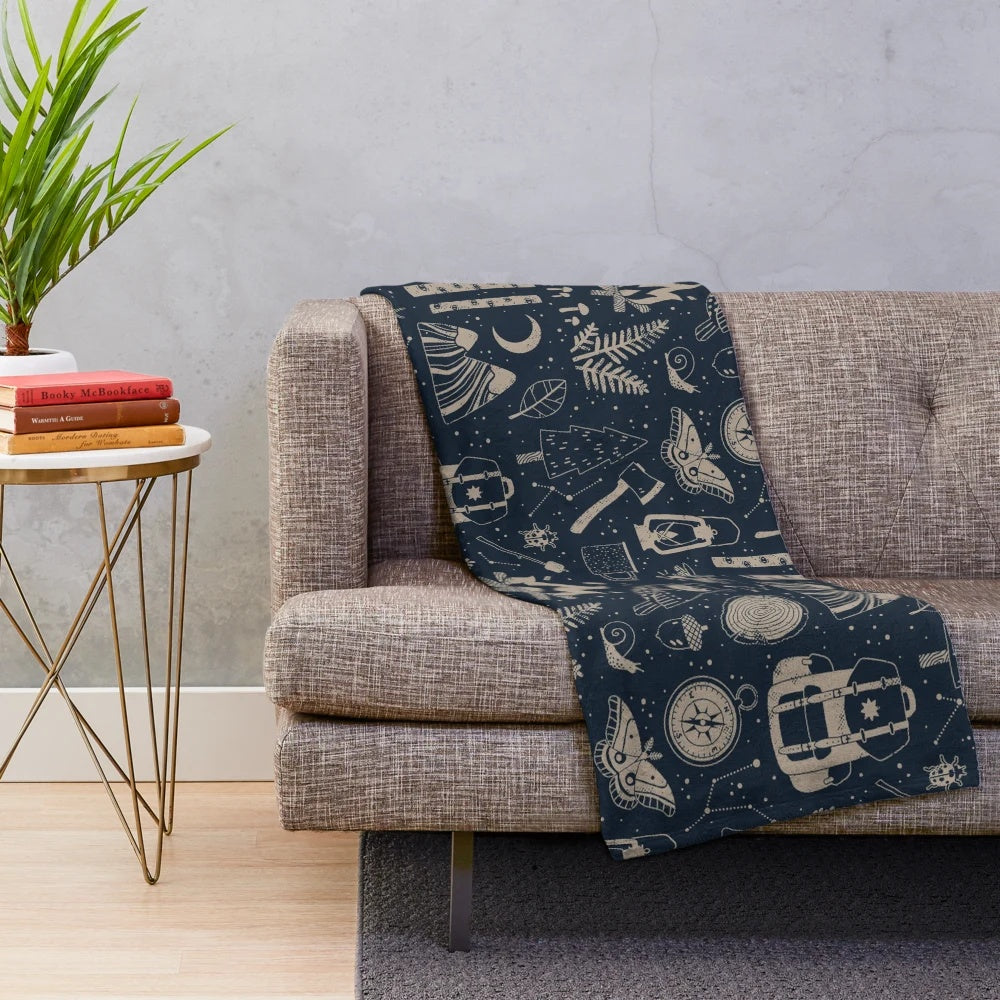 Forest-themed plush blanket with nature motifs