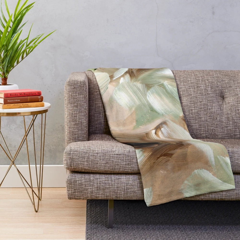 Plush abstract green and brown blanket with earthy forest-inspired patterns