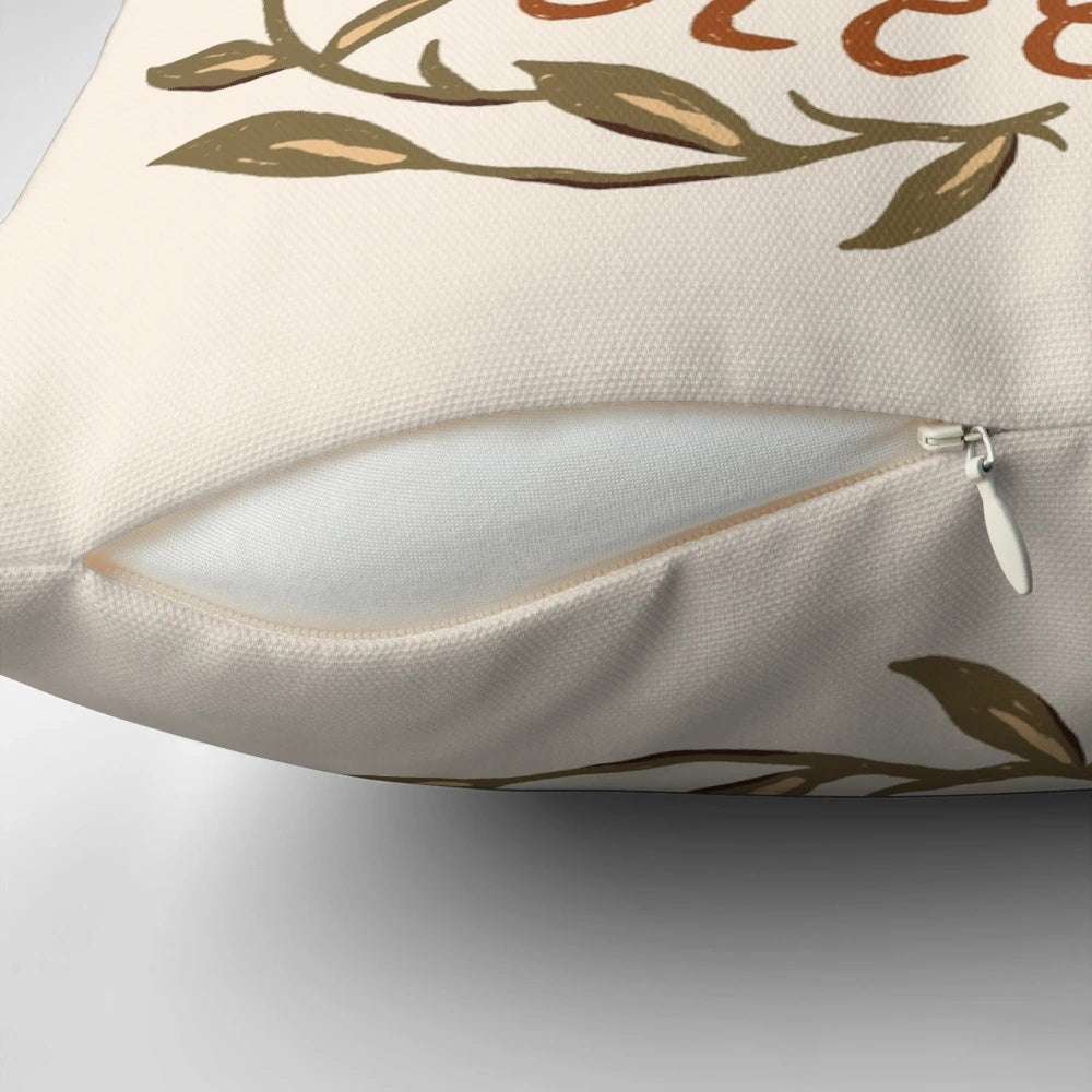 A cozy fox-themed decorative pillow with floral design and inspirational handlettering