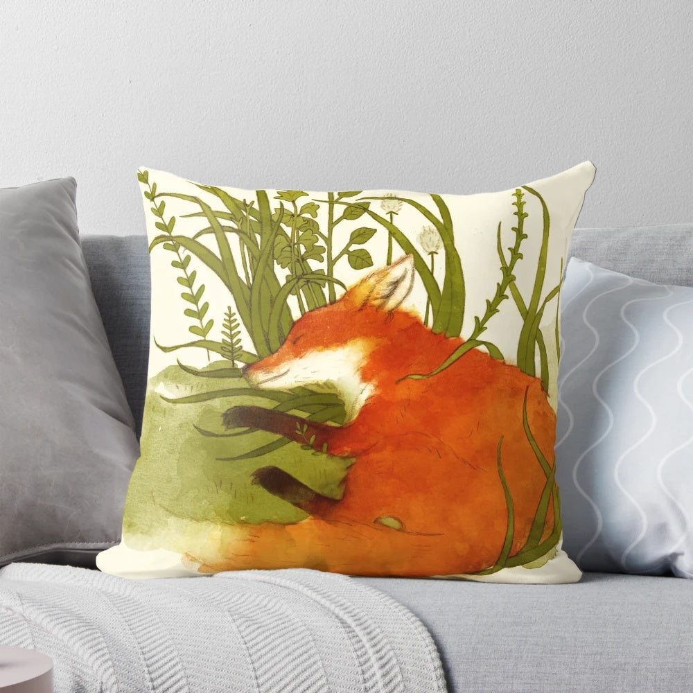 Watercolor illustration of a sleeping fox on a green and orange pillow