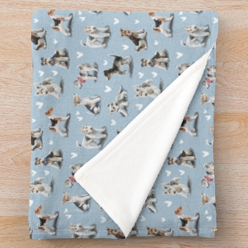 A soft, plush blanket featuring the image of a fox terrier dog