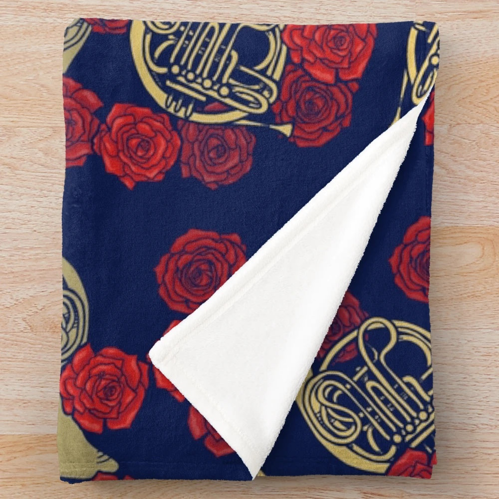 French horn and roses printed on a soft, plush blanket