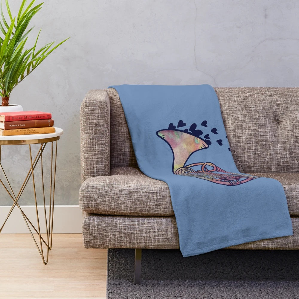 A plush and cozy French horn themed blanket perfect for music enthusiasts.