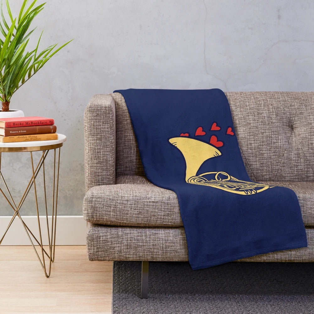 Plush blanket featuring a French horn design for music enthusiasts