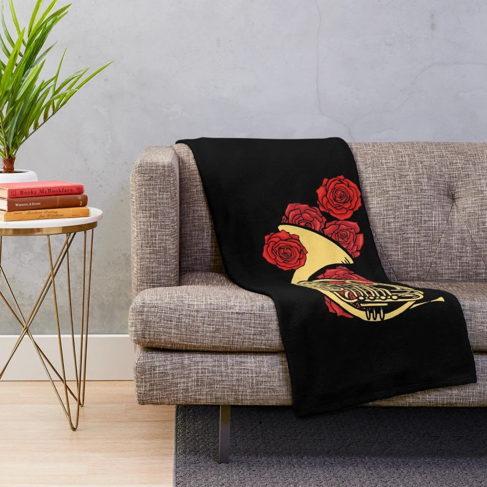 Soft plush blanket featuring a french horn design for music lovers