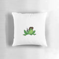 A green decorative pillow with a cute frog design, perfect for a western-inspired home.