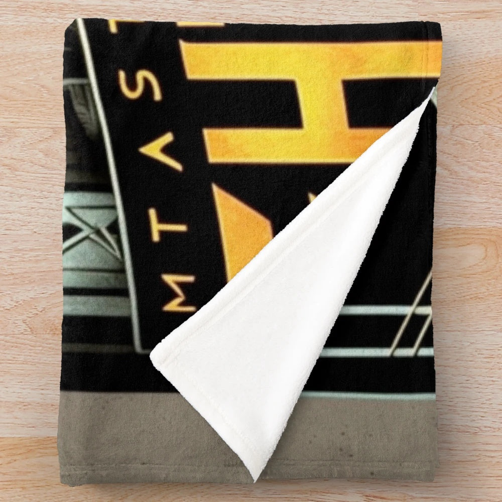 Colorful futuristic cinema-themed plush blanket