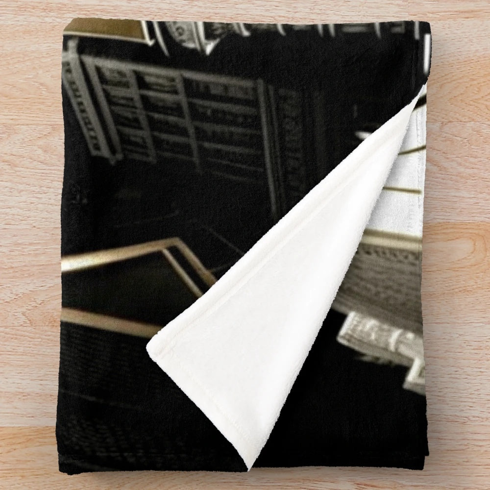 Futuristic city-inspired gray, black, beige, and white plush blanket