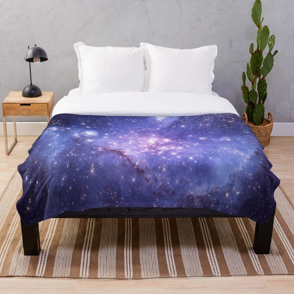 Galaxy plush blanket with stars, planets, and cosmic design