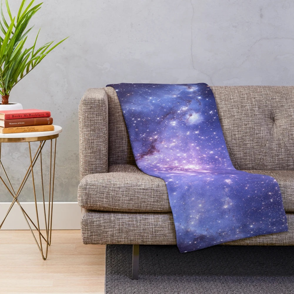 Galaxy plush blanket with stars, planets, and cosmic design