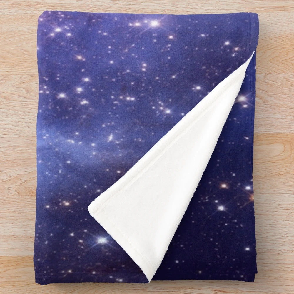 Galaxy plush blanket with stars, planets, and cosmic design