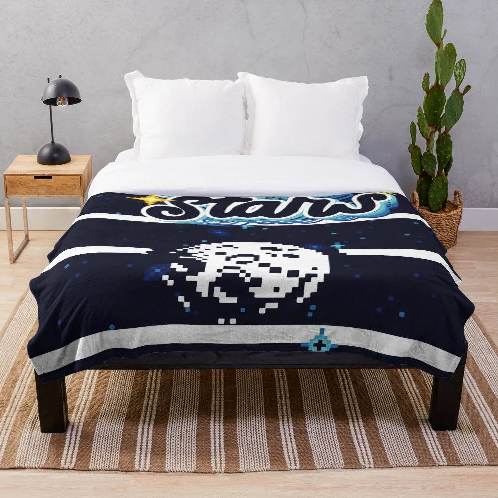 Plush blanket with a galaxy and stars design