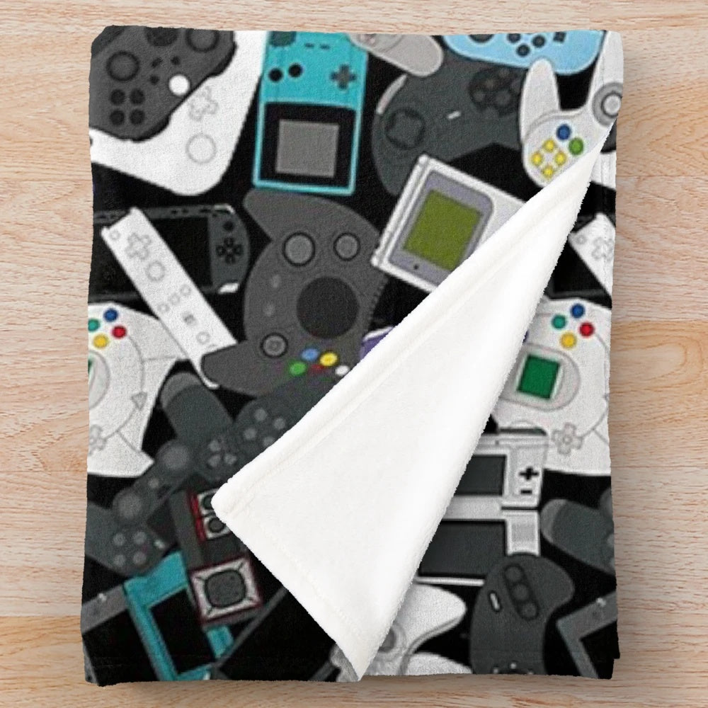 Plush gaming blanket featuring a retro game controller design