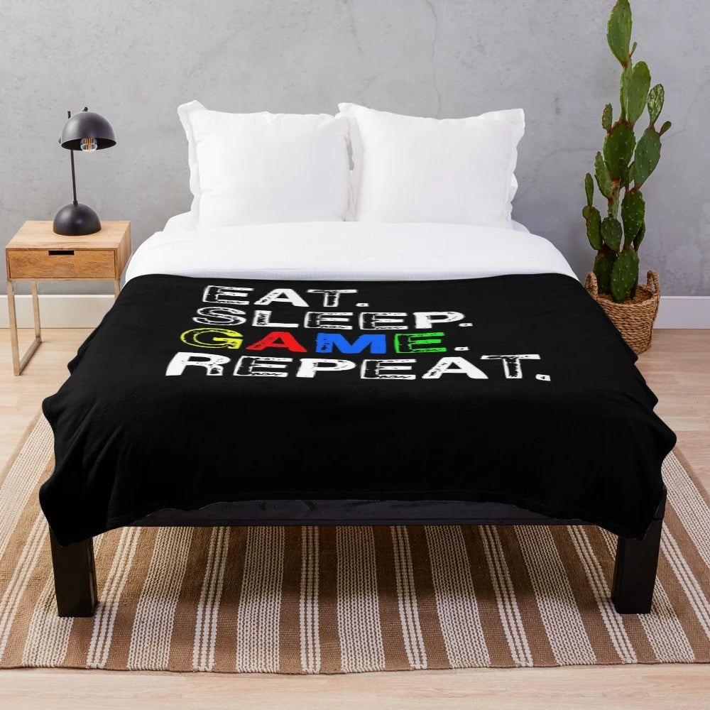 Gaming-themed plush blanket with "Eat, Sleep, Game, Repeat" design