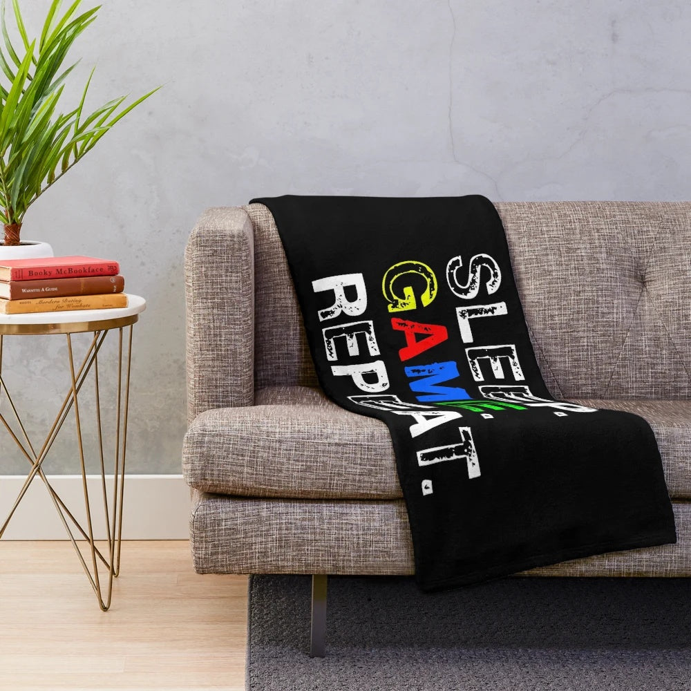 Gaming-themed plush blanket with "Eat, Sleep, Game, Repeat" design