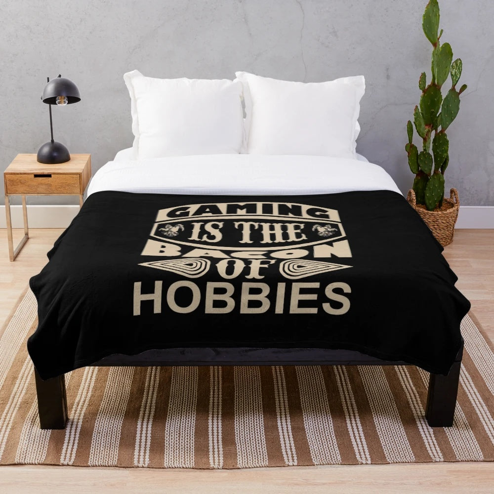Cozy gaming blanket featuring the text "Gaming Is The Bacon Of Hobbies