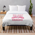 Plush gaming blanket with various gaming-themed patterns