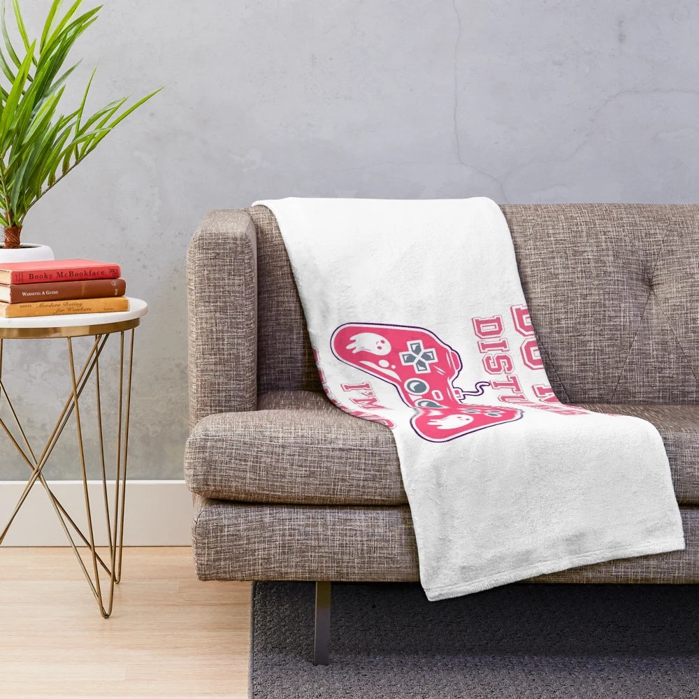 Plush gaming blanket with various gaming-themed patterns