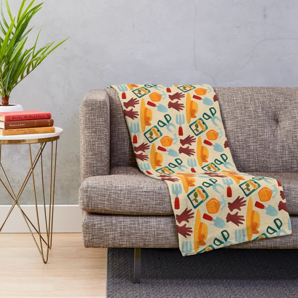 Soft and cozy plush blanket featuring a playful garden-themed design