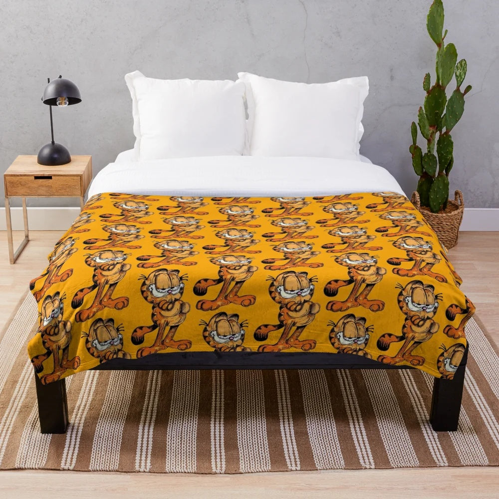 Soft and cuddly plush blanket featuring the iconic Garfield cat character