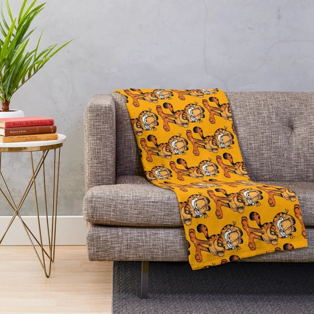 Soft and cuddly plush blanket featuring the iconic Garfield cat character