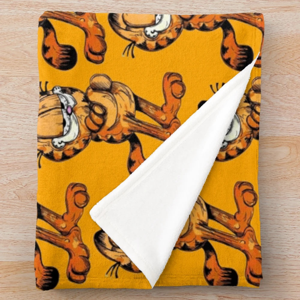 Soft and cuddly plush blanket featuring the iconic Garfield cat character