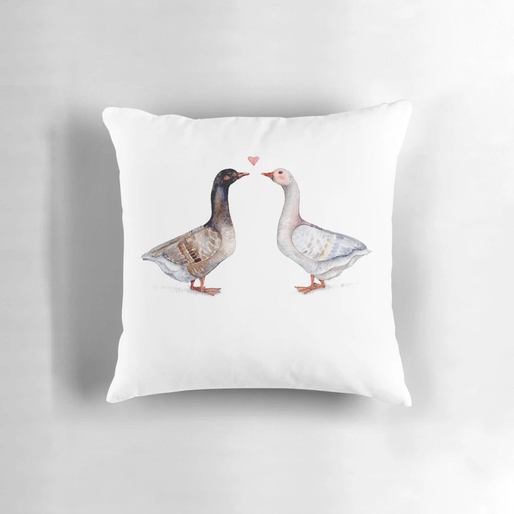 Decorative pillow featuring a pair of loving geese, perfect for couples and anniversary gifts.