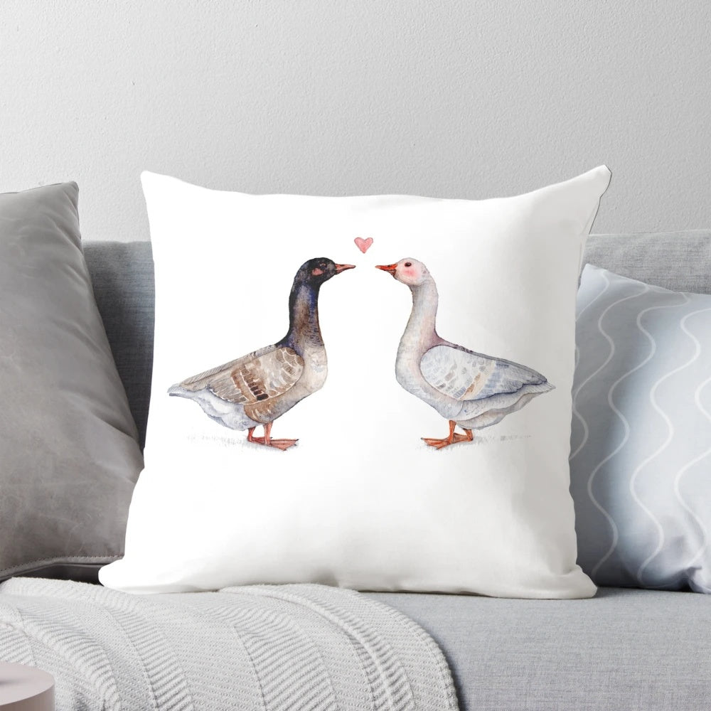 Decorative pillow featuring a pair of loving geese, perfect for couples and anniversary gifts.