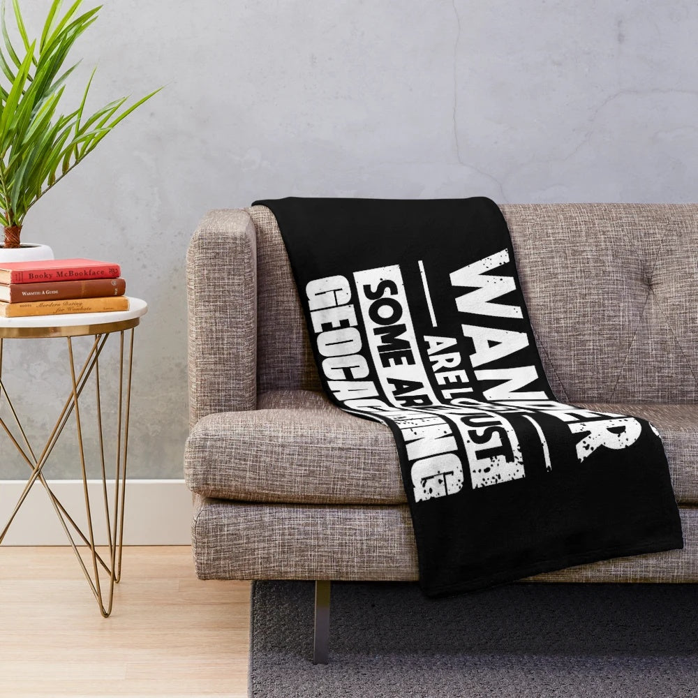 Soft and warm geocaching-themed plush blanket