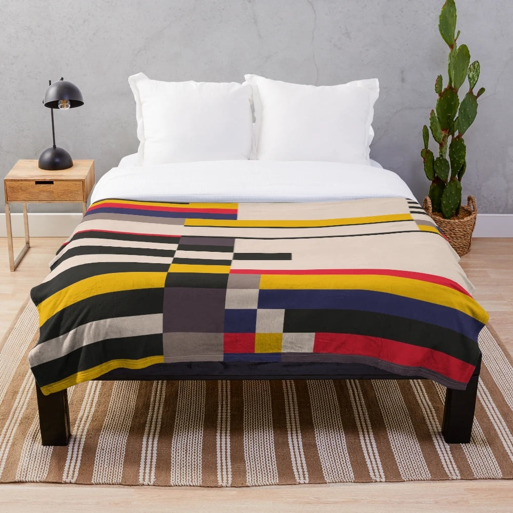 Geometric design inspired plush blanket with abstract patterns and color blocks