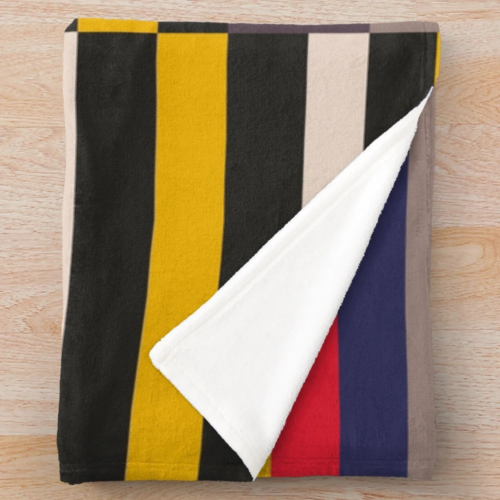 Geometric design inspired plush blanket with abstract patterns and color blocks