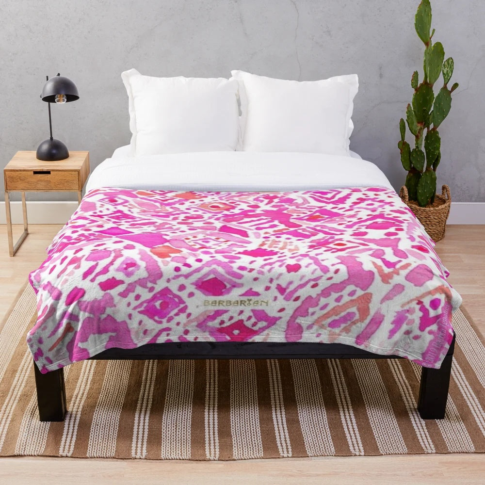 Soft and cozy plush blanket with a stylish geometric pattern