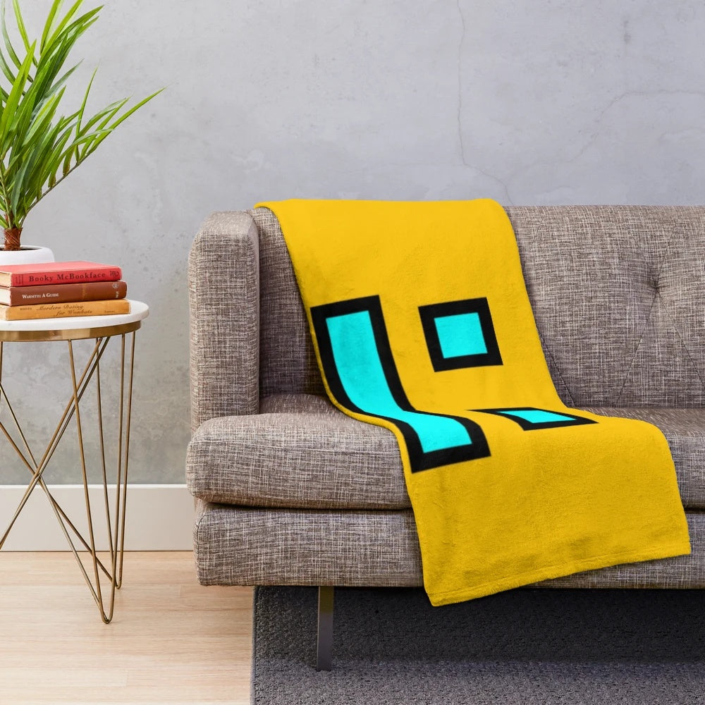 Geometry Dash themed plush blanket with geometric patterns