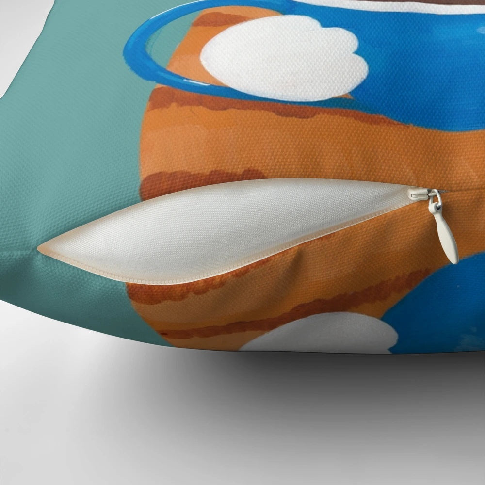 A charming ginger cat wearing glasses and sipping on a cappuccino, depicted on a decorative throw pillow.