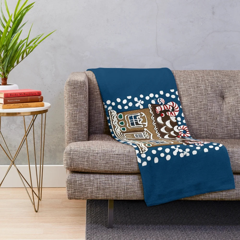 Soft, plush gingerbread house-themed blanket for cozy winter nights
