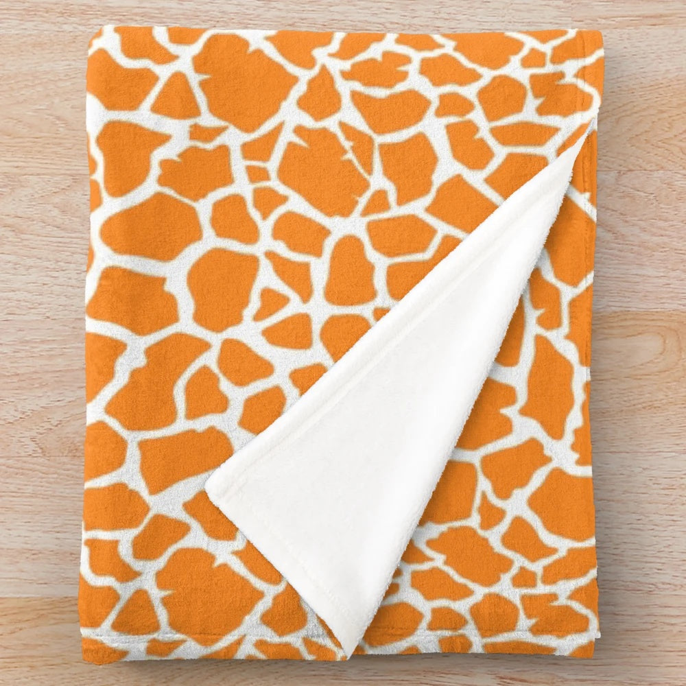 Giraffe plush blanket with soft, textured fabric