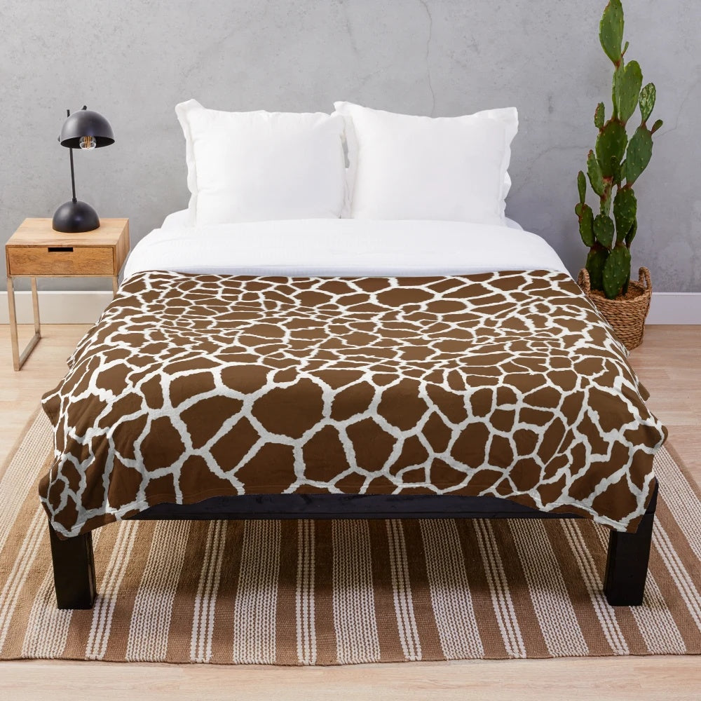 Giraffe print plush blanket with soft, luxurious texture