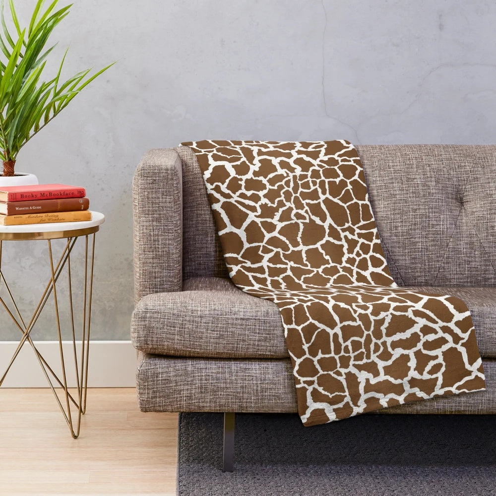 Giraffe print plush blanket with soft, luxurious texture