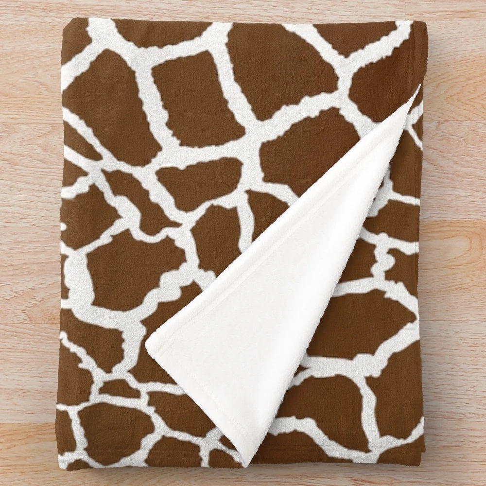 Giraffe print plush blanket with soft, luxurious texture